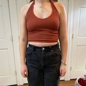 Out from under burnt orange halter